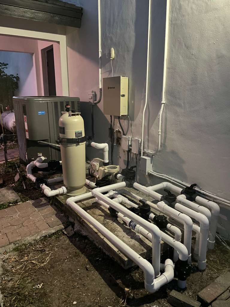 Complete pool equipment setup with pump, filter, heater, and automation system