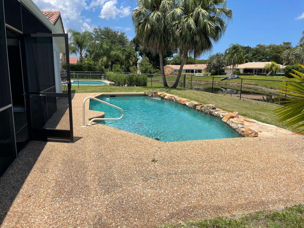 Pool with decorative rock coping and textured deck finish